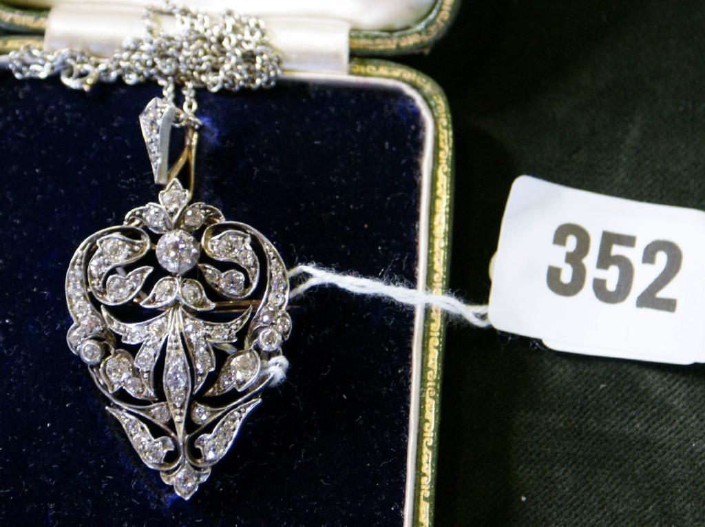 Appraisal: An Art Nouveau pendant with profusely pierced decoration and diamond