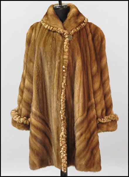 Appraisal: GOLDEN WHISKEY MINK LENGTH SWING COAT Cuffs collar and closure