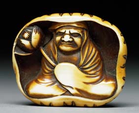 Appraisal: ANTIQUE IVORY NETSUKE Antique carved and stained ivory netsuke of