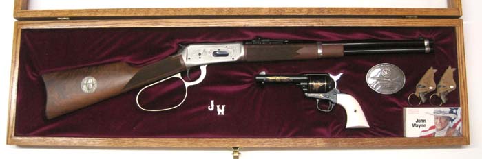 Appraisal: JOHN WAYNE COMMEMORATIVE TWO GUN SET Colt SAA colt caliber