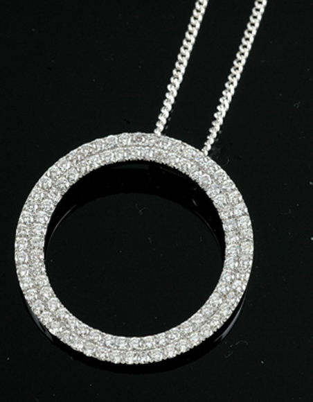 Appraisal: A diamond pendant The large open circle claw set with