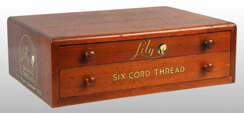 Appraisal: Lily Sewing Thread Spool Cabinet Description Walnut wood with original