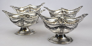 Appraisal: A set of four Edwardian Adam style stemmed bonbon baskets