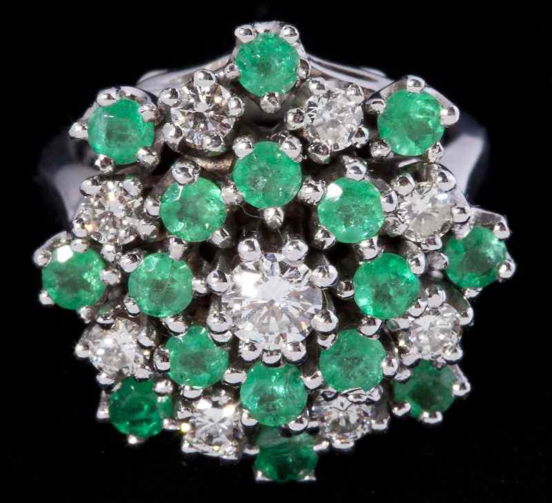 Appraisal: Diamond and Emerald Dinner Ringin a domed form centering on