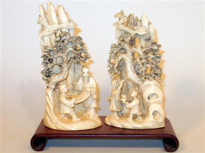 Appraisal: Two Chinese elephant or mammoth ivory carvings Both carved in