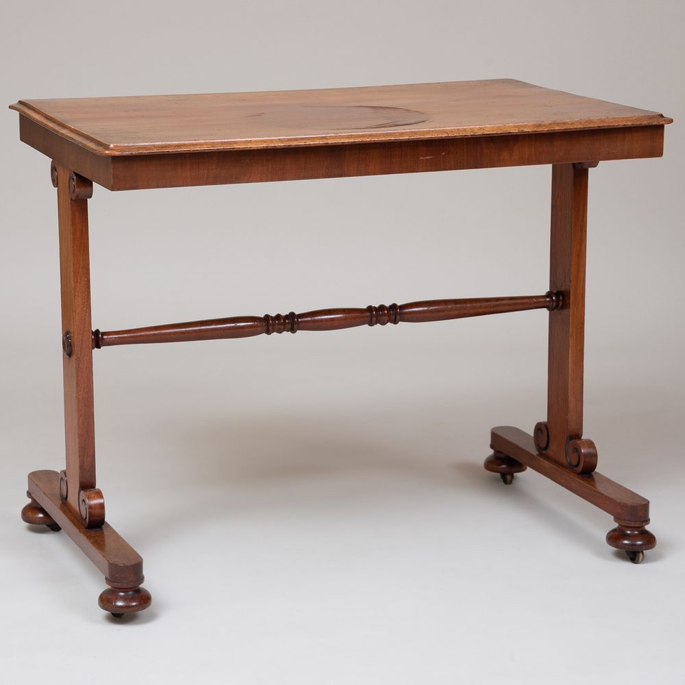 Appraisal: Regency Mahogany Trestle Writing Table Raised on casters x x