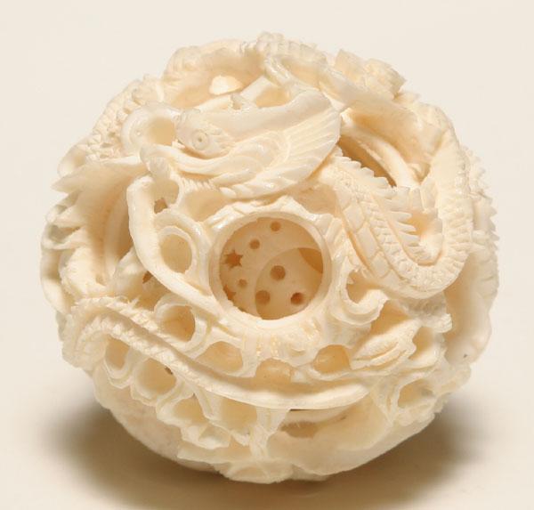 Appraisal: Chinese carved ivory dragon mystery puzzle ball inch diameter The