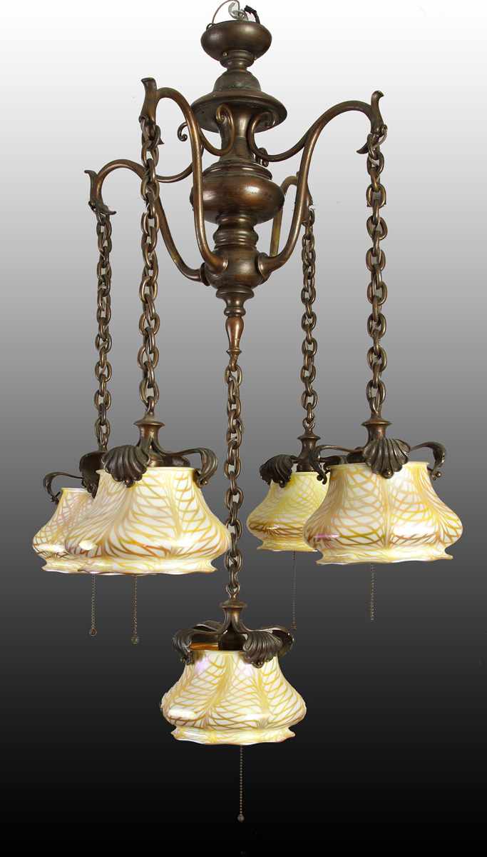 Appraisal: Patinated Brass Light Chandelier w Quezal Shades C Excellent iridescent