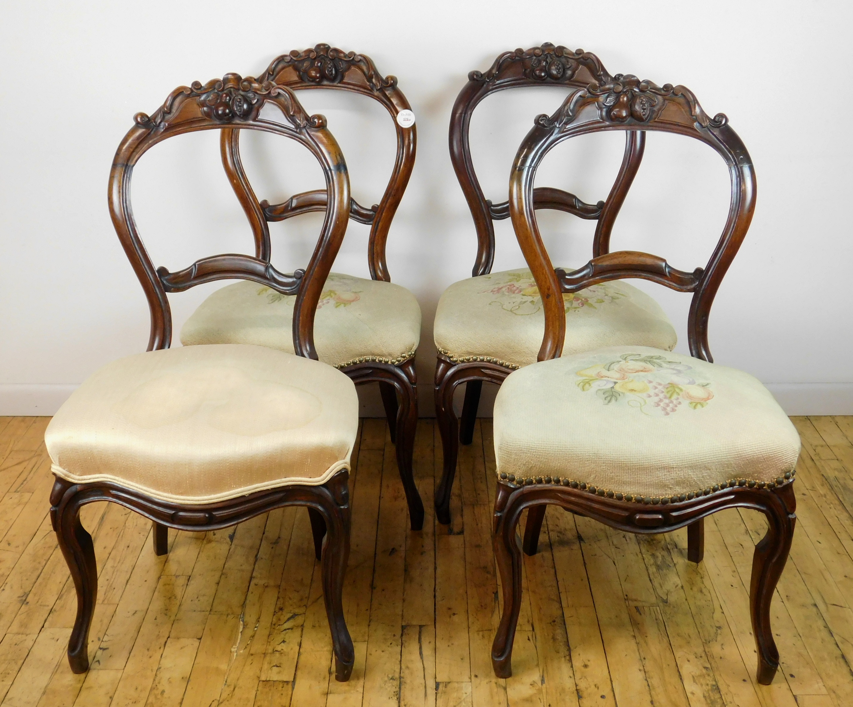 Appraisal: Set of carved wooden needlepoint chairs with fruit motif chair