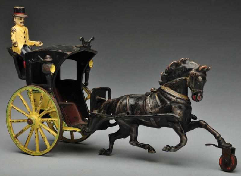 Appraisal: Cast Iron Hansom Cab Horse-Drawn Toy Description American Made by