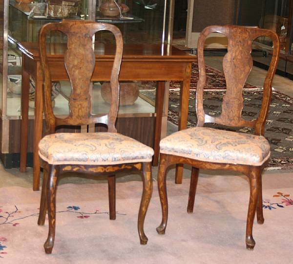 Appraisal: A pair of Dutch Rococo style marquetry inlaid side chairs