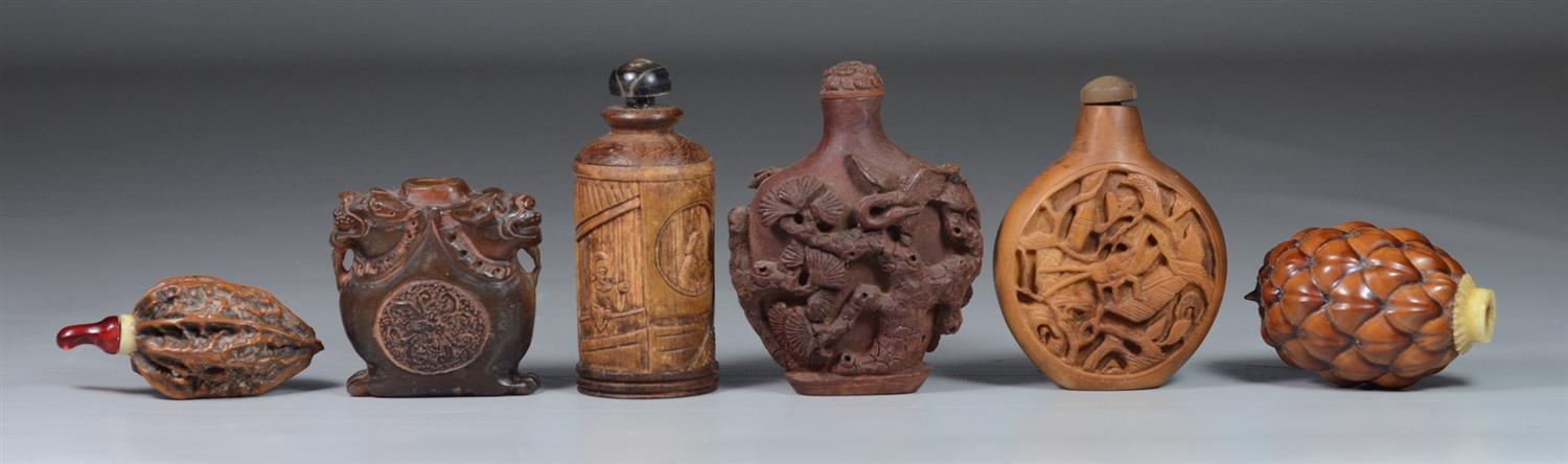 Appraisal: Carved wood Chinese snuff bottles lacking stoppers tallest