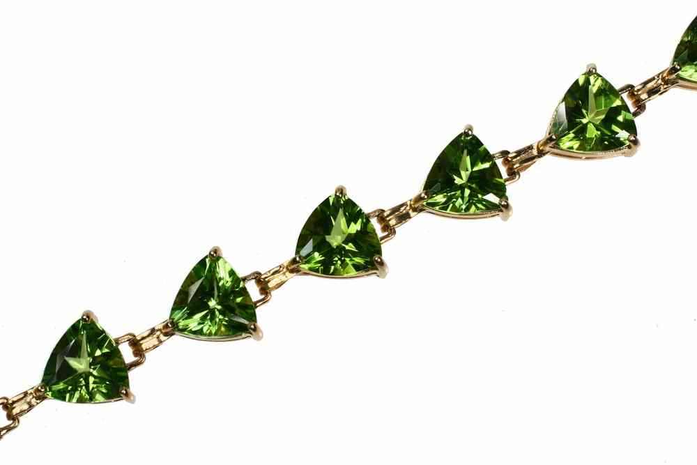 Appraisal: BRACELET - One K yellow gold and peridot bracelet with