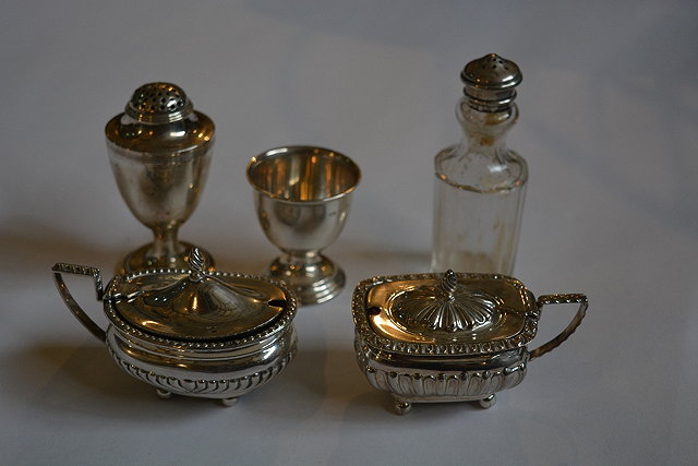 Appraisal: Small collection of silver condiments etcincluding a Georgian urn-shaped pepper