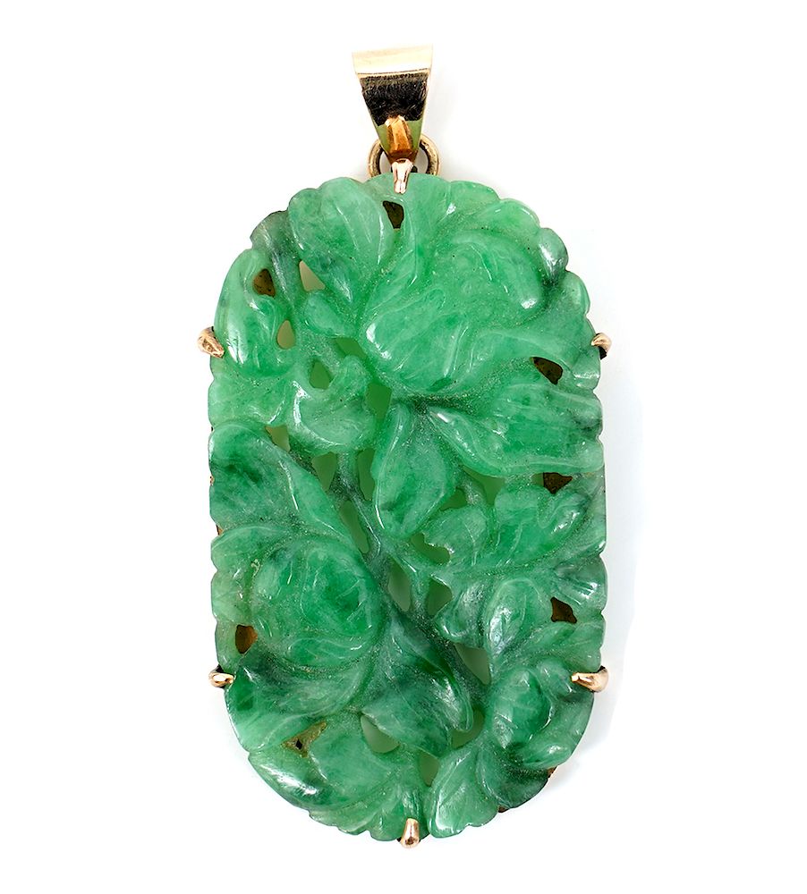 Appraisal: Chinese Carved Green Jade Gold Pendant Chinese carved jade kt