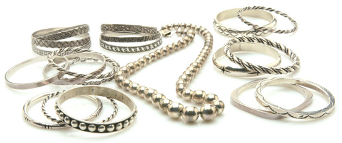 Appraisal: Nineteen sterling bangle bracelets and a necklace of gaduated Mexican