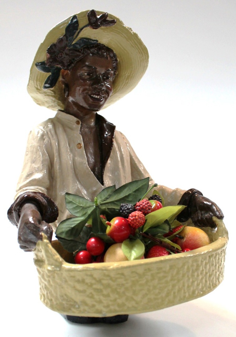 Appraisal: A early thC plaster figure of a fruit seller quarter