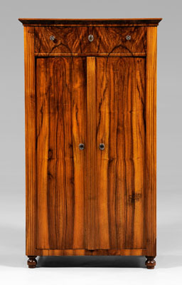 Appraisal: Biedermeier walnut-veneered cabinet figured walnut veneers throughout dovetailed drawer over