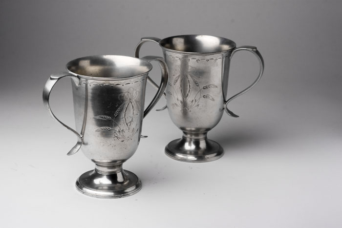 Appraisal: PAIR OF PEWTER TWO-HANDLED CUPS ATTRIBUTED TO BROADHEAD GURNEY SPORLE