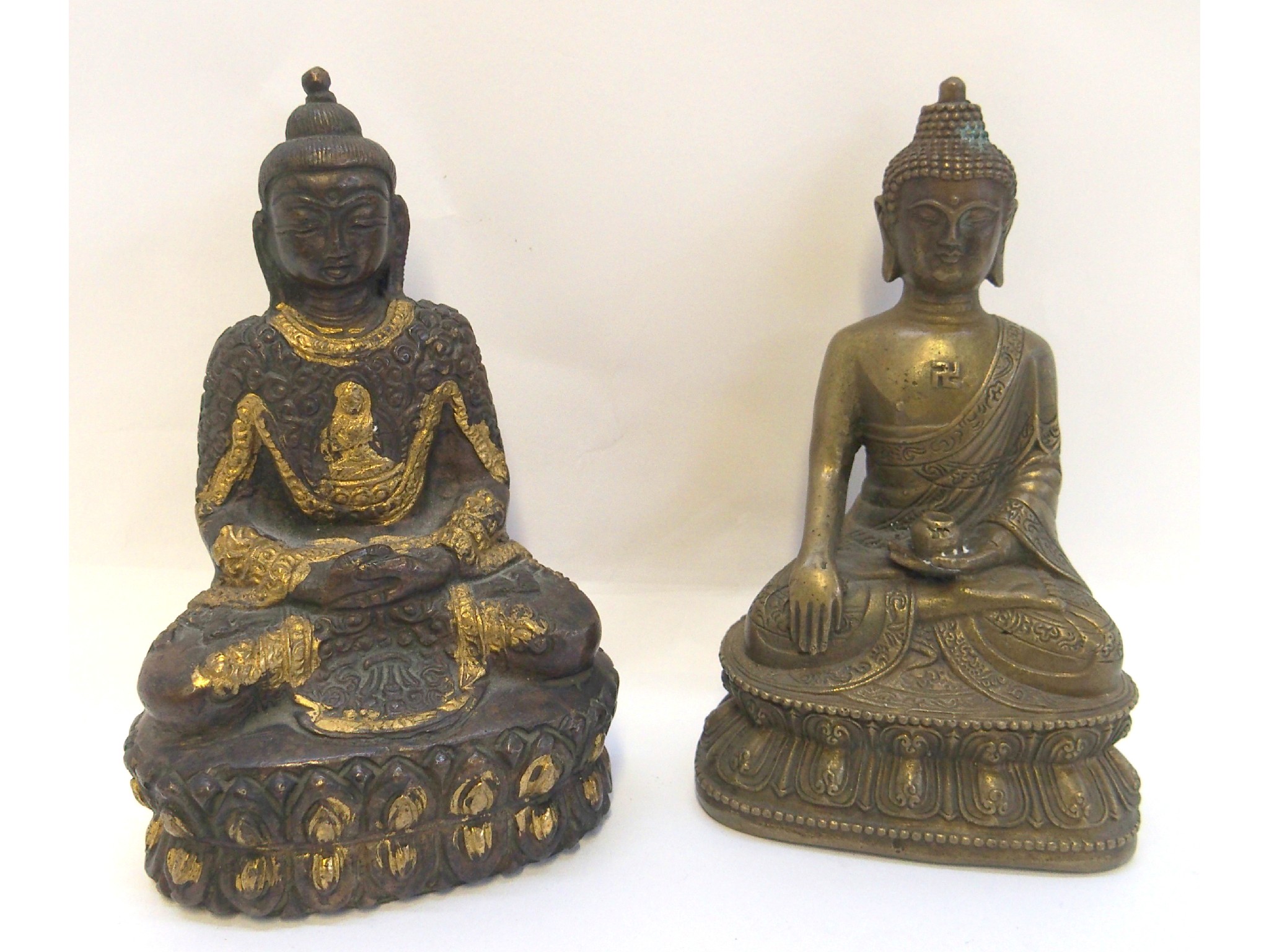 Appraisal: A Chinese bronze model of Buddha seated in classical lotus