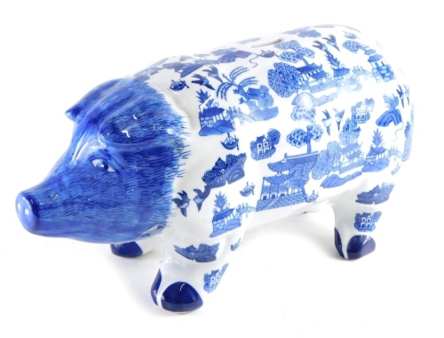 Appraisal: A thC UK Sculptures pig money box blue transfer printed