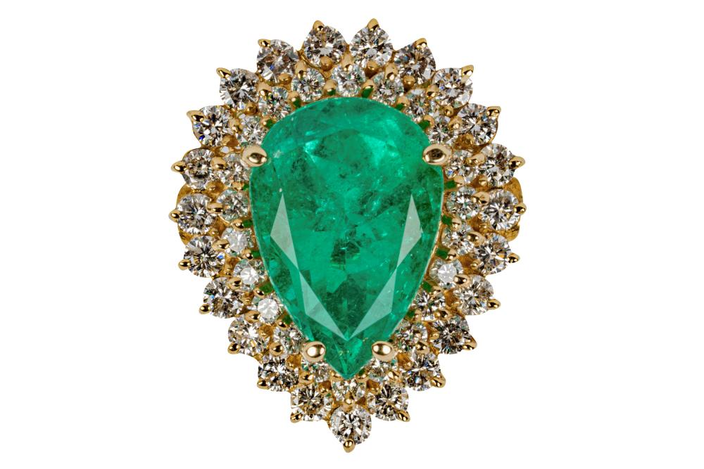 Appraisal: KARAT YELLOW GOLD DIAMOND EMERALD RINGcentering one pear shape emerald