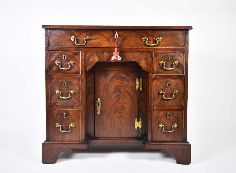 Appraisal: GEORGE III MAHOGANY KNEE-HOLE DESKCirca The rectangular molded top above