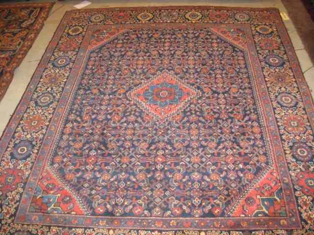 Appraisal: Shiraz Persian Handmade Rug overall pattern on blue field semi-antique