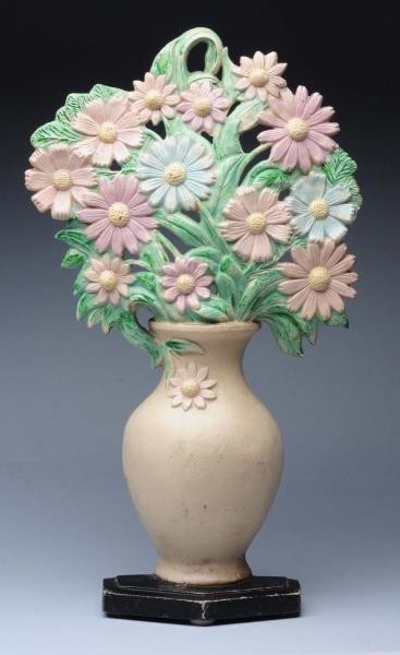 Appraisal: Cast Iron Cosmos in Vase Doorstop Largest flower in vase