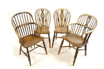 Appraisal: A th century ash low back Windsor armchair with a