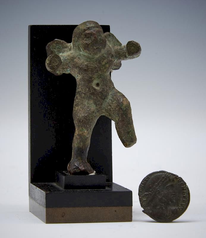 Appraisal: Roman bronze cupid figure on stand and ancient coin Archaic