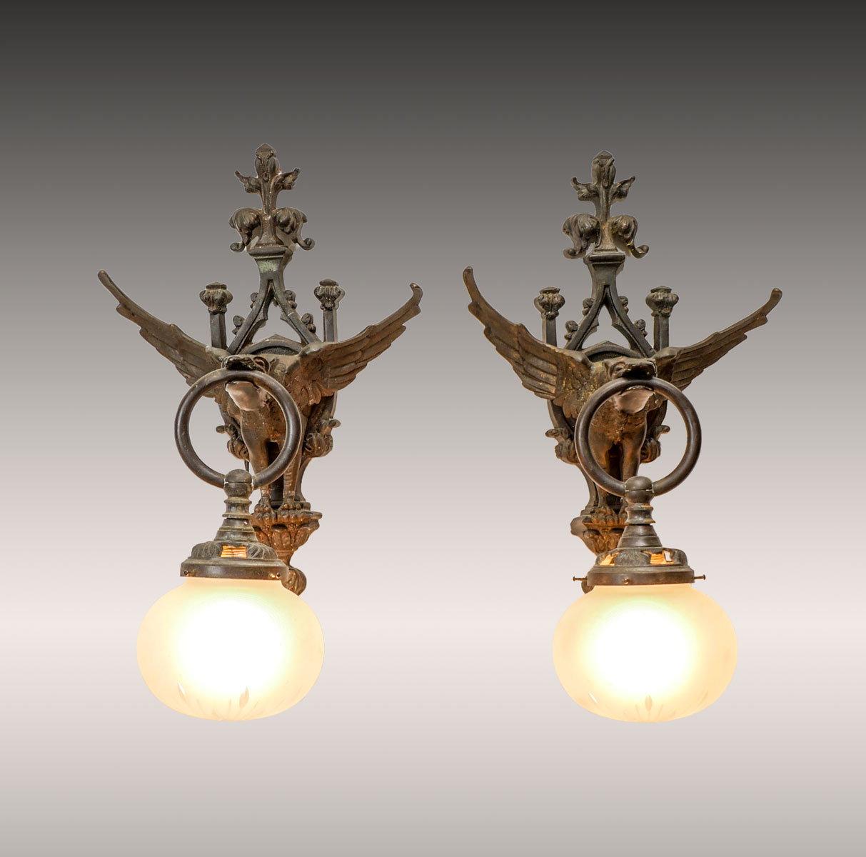 Appraisal: PAIR OF BRONZE GOTHIC VICTORIAN GRIFFIN DRAGON SCONCES single light