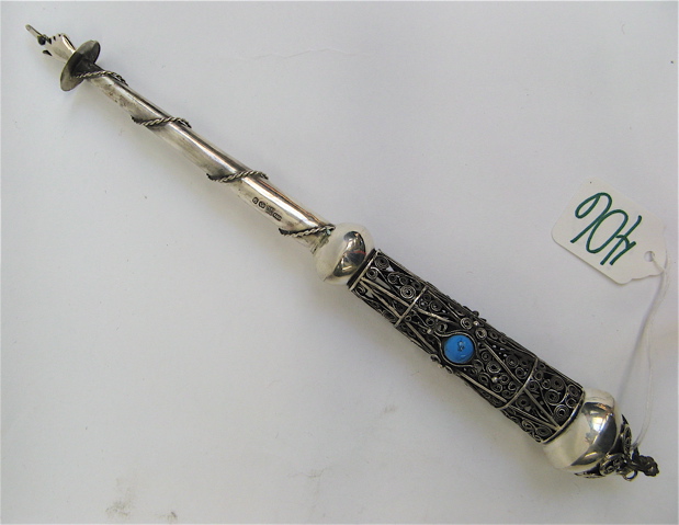 Appraisal: SILVER TORAH PAGE TURNER with inset turquoise-like round stones on