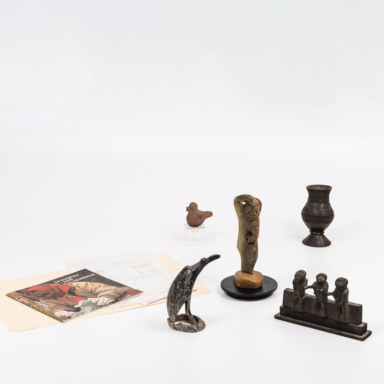 Appraisal: FIVE SMALL COLLECTIBLE FIGURES including a clay bird figure one