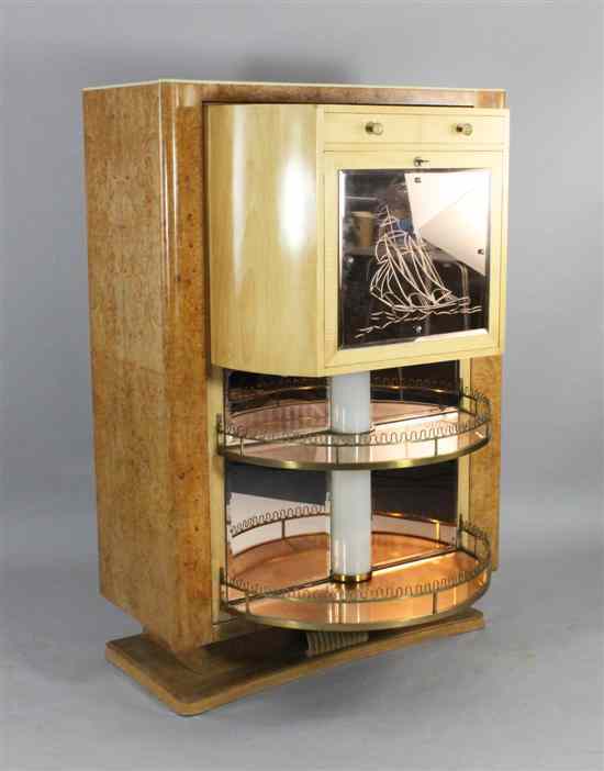 Appraisal: An Art Deco birds eye maple swivel cocktail cabinet opening