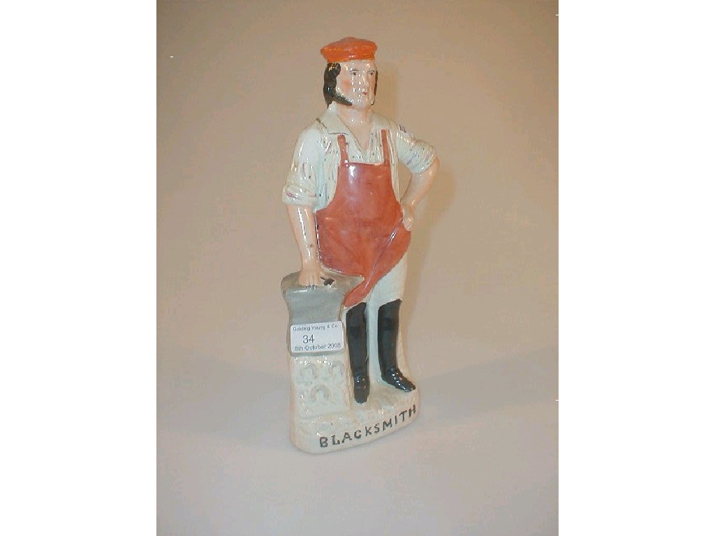 Appraisal: A thC Staffordshire Pottery figure of a blacksmith standing beside