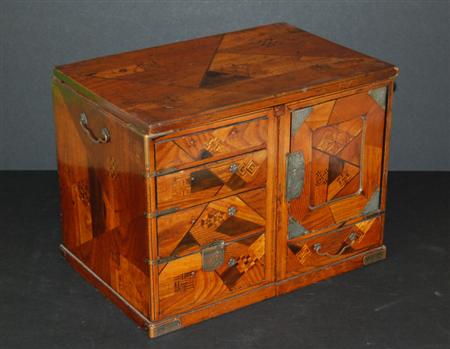 Appraisal: A Japanese specimen wood tea ceremony cabinet Meiji period of