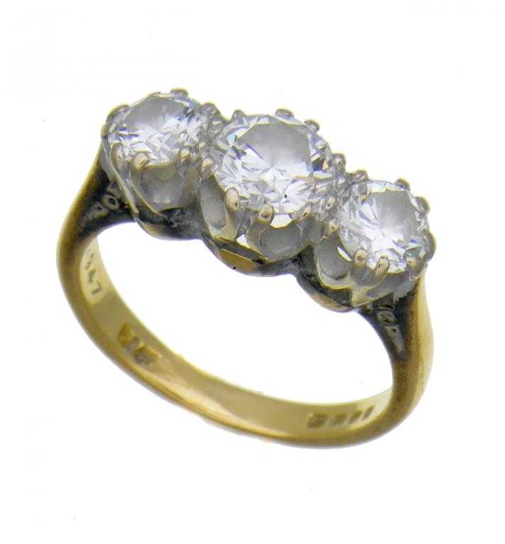 Appraisal: A DIAMOND THREE-STONE RING gold hoop London