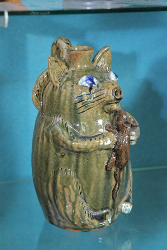 Appraisal: TOM AND JERRY STONEWARE JUG BY ALBERT HODGES Having an