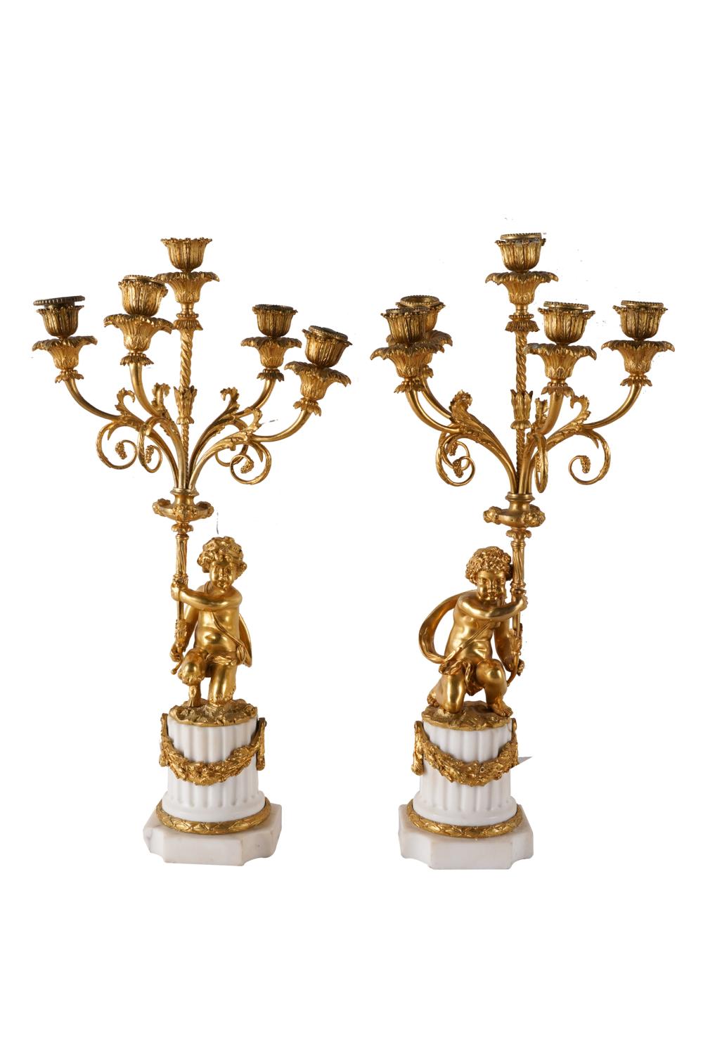 Appraisal: PAIR OF GILT BRONZE FIVE-LIGHT CANDELABRAmounted to white marble Condition