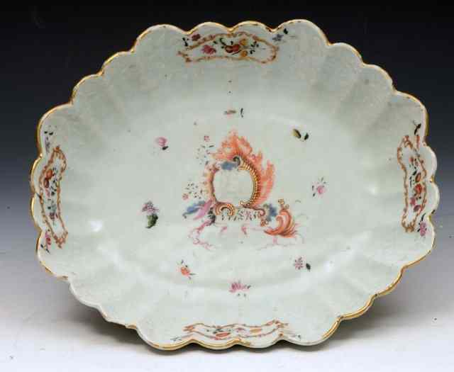 Appraisal: A CHINESE LOBED BASKET with famille rose cartouche and central