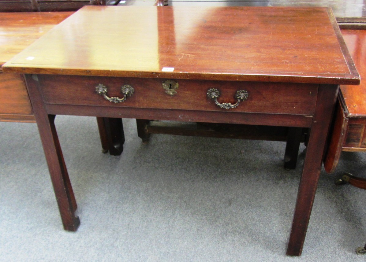 Appraisal: A mid th century mahogany single drawer side table on