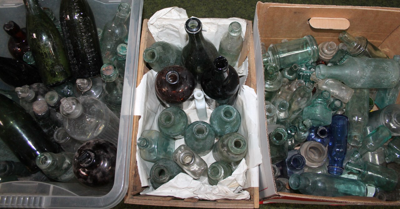 Appraisal: Various glass bottles to include green glass shouldered example cm