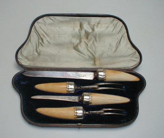 Appraisal: A Victorian carving set comprising two forks carving knife and