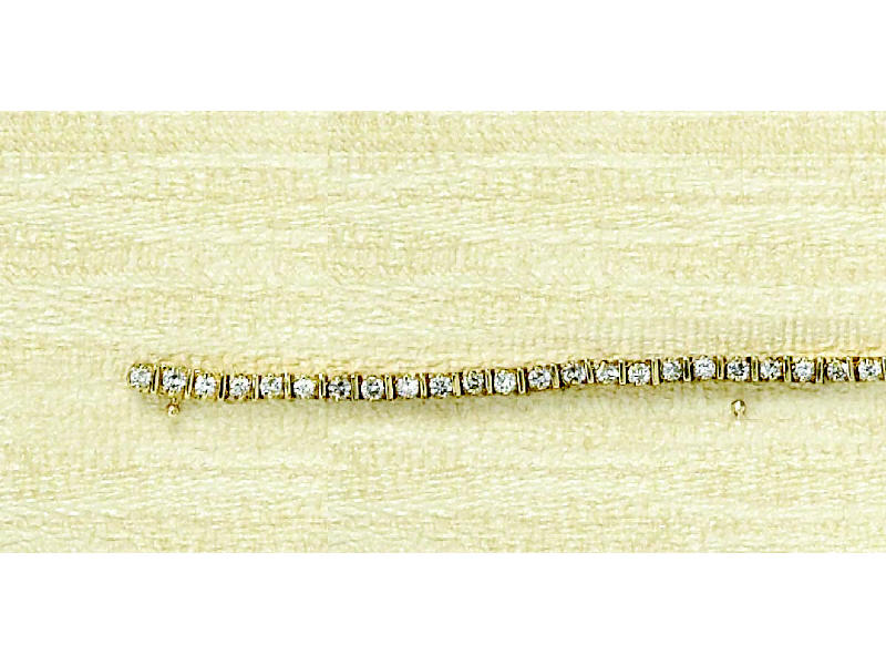 Appraisal: DIAMOND TENNIS BRACELET k yellow gold bracelet with bar link