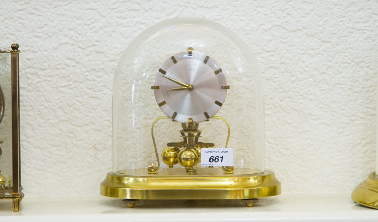 Appraisal: Torsion Clock Oval Glass Dome On A Brass Base