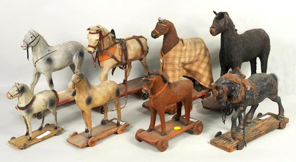 Appraisal: Eight Early Horse Pull Toys Eight early horse pull toys