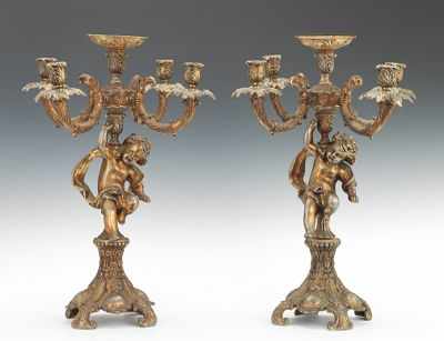 Appraisal: A Pair of Large Cast Metal Candelabra Four-branch candle holders