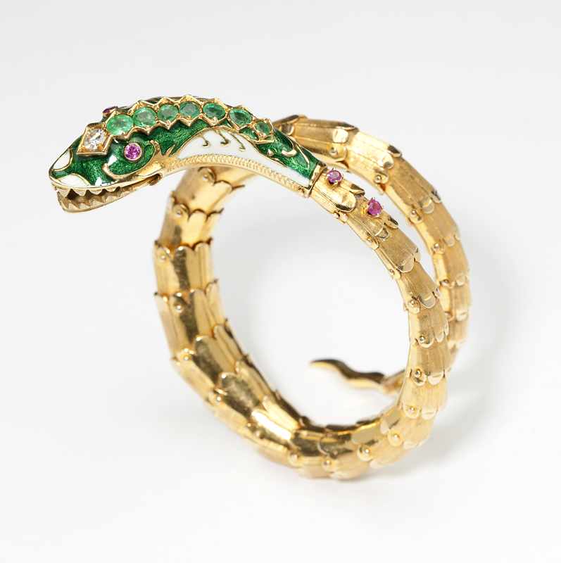 Appraisal: Flexible coiled K gold and enamel accented with rubies and