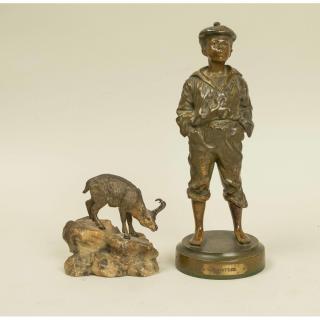 Appraisal: Two Bronze Sculptures Two bronze sculptures Standing boy with plaque